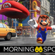 Mario throws his cap across a street in New Donk City, in a scene from Super Mario Odyssey.